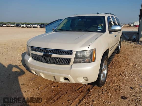 2013 Chevrolet Suburban LTZ with VIN 1GNSCKE05DR288935, listed as a IAAI auction lot 43067775 with 246,738 mi miles and . Bid and sale history available at DreamBid. Image 12.