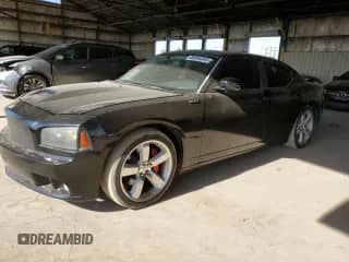 2008 Dodge Charger SRT-8 с VIN 2B3LA73W18H198034, выставлен на аукционе Copart как лот 66955345 с пробегом 30 292 миль миль и Чистый • Clean title. История ставок и продаж доступна на DreamBid. Изображение 1.