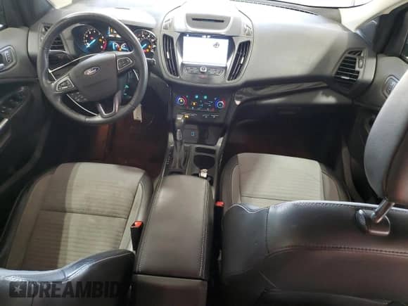 2018 Ford Escape SE with VIN 1FMCU9GD2JUC25153, listed as a Copart auction lot 87018485 with 104,172 mi miles and Salvage title. Bid and sale history available at DreamBid. Image 8.