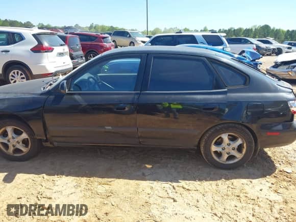 2005 Hyundai Elantra GLS z VIN KMHDN56D35U150190, wystawiony jako IAAI lot #42005231 z przebiegiem 217 677 mil mil oraz . Historia ofert i sprzedaży dostępna na DreamBid. Obrazek 14.