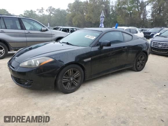 2008 Hyundai Tiburon GS с VIN KMHHM66D48U265203, выставлен на аукционе Copart как лот 49837525 с пробегом 104 259 миль миль и Чистый • Clean title. История ставок и продаж доступна на DreamBid. Изображение 1.