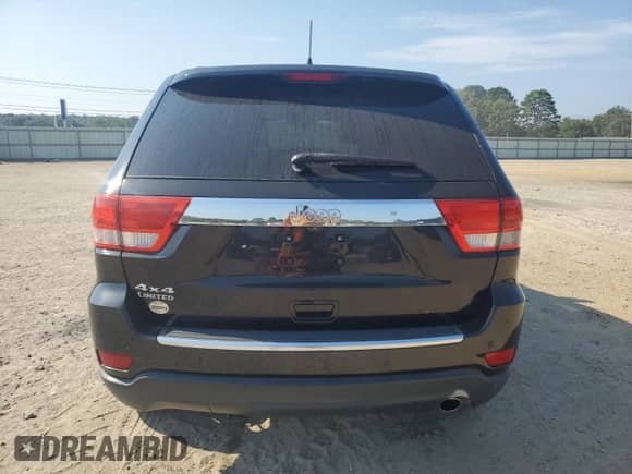 2013 Jeep Grand Cherokee Limited with VIN 1C4RJFBG3DC585890, listed as a Copart auction lot 69133595 with 181,993 mi miles and Clean title. Bid and sale history available at DreamBid. Image 6.