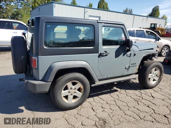 2015 Jeep Wrangler Sport with VIN 1C4AJWAG7FL613059, listed as a Copart auction lot 69094475 with 105,891 mi miles and Salvage title. Bid and sale history available at DreamBid. Image 3.