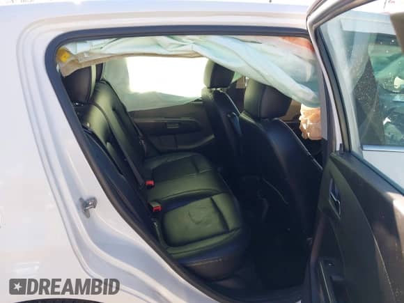 2013 Chevrolet Sonic LTZ with VIN 1G1JE6SH7D4139965, listed as a IAAI auction lot 41288598 with 136,528 mi miles and . Bid and sale history available at DreamBid. Image 8.