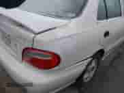 1999 Hyundai Accent GL z VIN KMHVF24N1XU583604, wystawiony jako IAAI lot #41613240 z przebiegiem 163 938 mil mil oraz . Historia ofert i sprzedaży dostępna na DreamBid. Obrazek 6.