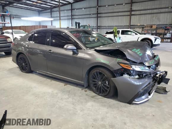 2023 Toyota Camry Hybrid XSE с VIN 4T1K31AK7PU608103, выставлен на аукционе Copart как лот 71901105 с пробегом 65 154 миль миль и Списание • Salvage title. История ставок и продаж доступна на DreamBid. Изображение 4.