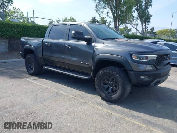 2022 Ram 1500 TRX with VIN 1C6SRFU91NN392885, listed as a IAAI auction lot 42482710 with 13,090 mi miles and . Bid and sale history available at DreamBid. Image 1.