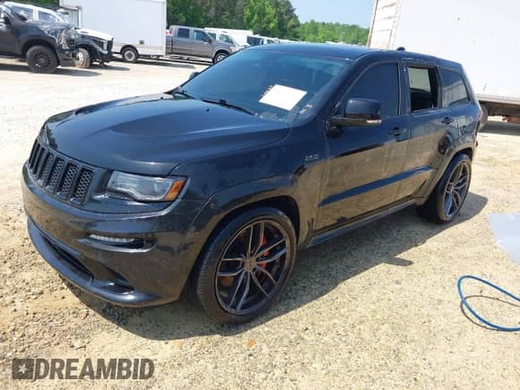 2014 Jeep Grand Cherokee SRT-8 z VIN 1C4RJFDJ7EC527372, wystawiony jako IAAI lot #41889040 z przebiegiem 120 015 mil mil oraz . Historia ofert i sprzedaży dostępna na DreamBid. Obrazek 2.