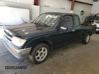 1997 Toyota Tacoma with VIN 4TAVL52N5VZ256443, listed as a Copart auction lot 57880284 with 133,989 mi miles and Clean title. Bid and sale history available at DreamBid. Image 1.