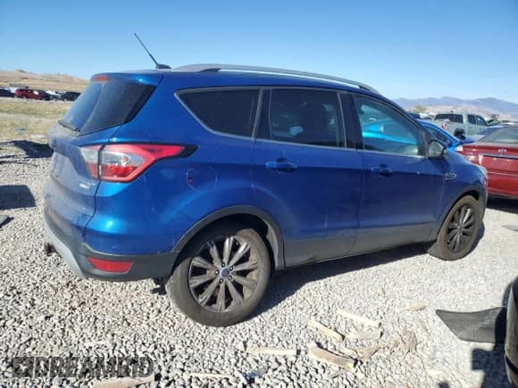 2017 Ford Escape Titanium with VIN 1FMCU9J97HUC07973, listed as a Copart auction lot 80717215 with 129,024 mi miles and Salvage title. Bid and sale history available at DreamBid. Image 3.