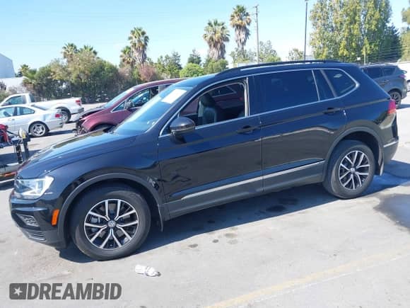 2021 Volkswagen Tiguan SE with VIN 3VV3B7AX4MM127236, listed as a IAAI auction lot 43100517 with 48,229 mi miles and . Bid and sale history available at DreamBid. Image 2.