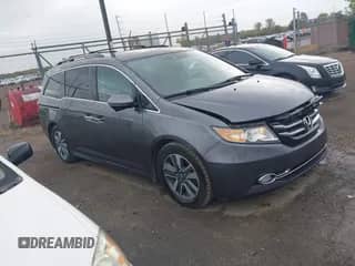 2016 Honda Odyssey Touring Elite z VIN 5FNRL5H92GB052661, wystawiony jako IAAI lot #43451962 z przebiegiem 145 569 mil mil oraz . Historia ofert i sprzedaży dostępna na DreamBid. Obrazek 1.