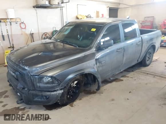 2018 Ram 1500 Rebel with VIN 1C6RR7YT1JS234777, listed as a IAAI auction lot 41409525 with 119,497 mi miles and . Bid and sale history available at DreamBid. Image 2.
