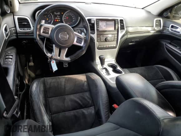 2012 Jeep Grand Cherokee SRT-8 z VIN 1C4RJFDJ7CC100156, wystawiony jako Copart lot #79865954 z przebiegiem 113 782 mil mil oraz Szkoda całkowita • Salvage title. Historia ofert i sprzedaży dostępna na DreamBid. Obrazek 8.