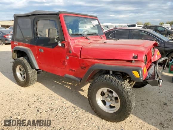 2000 Jeep Wrangler SE with VIN 1J4FA29P4YP798115, listed as a Copart auction lot 80751605 with 119,345 mi miles and Salvage title. Bid and sale history available at DreamBid. Image 4.