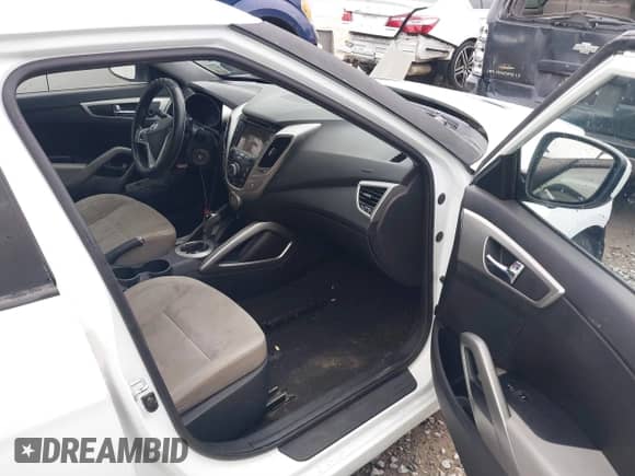 2014 Hyundai Veloster with VIN KMHTC6AD7EU217470, listed as a IAAI auction lot 41286296 with 150,034 mi miles and . Bid and sale history available at DreamBid. Image 5.