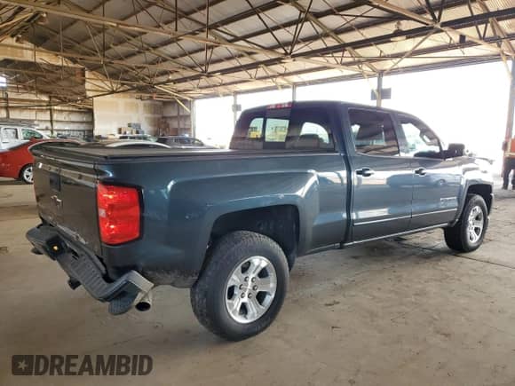 2018 Chevrolet Silverado 1500 LT with VIN 3GCUKREC9JG570580, listed as a Copart auction lot 69575445 with 106,245 mi miles and Salvage title. Bid and sale history available at DreamBid. Image 3.