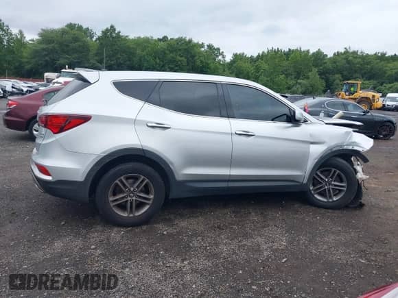 2018 Hyundai Santa Fe 2.4L z VIN 5XYZTDLB1JG530735, wystawiony jako IAAI lot #42893469 z przebiegiem 143 883 mil mil oraz . Historia ofert i sprzedaży dostępna na DreamBid. Obrazek 12.
