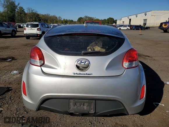 2013 Hyundai Veloster w/Black Int с VIN KMHTC6AD9DU086279, выставлен на аукционе Copart как лот 85276815 с пробегом 201 554 миль миль и Списание • Salvage title. История ставок и продаж доступна на DreamBid. Изображение 6.