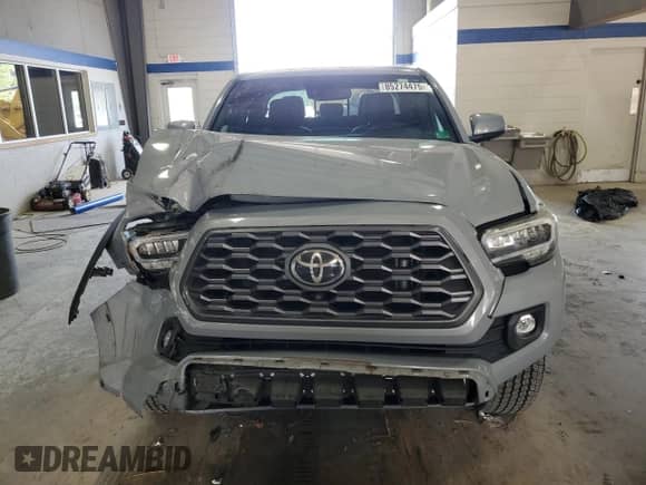 2020 Toyota Tacoma TRD Off Road с VIN 5TFCZ5AN9LX225426, выставлен на аукционе Copart как лот 85274475 с пробегом 55 086 миль миль и Списание • Salvage title. История ставок и продаж доступна на DreamBid. Изображение 5.