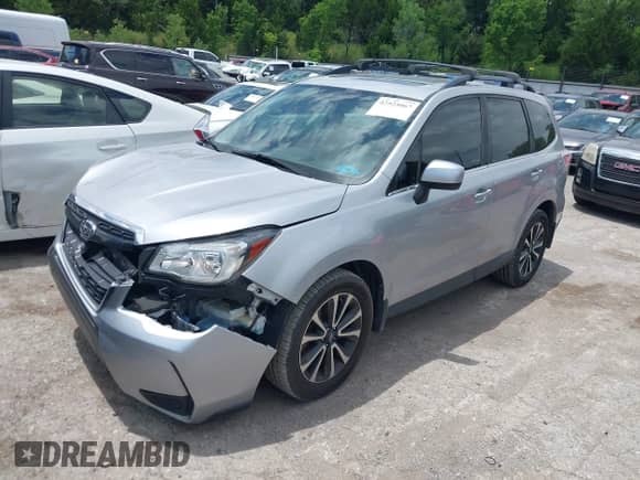 2018 Subaru Forester Premium with VIN JF2SJGEC1JH505082, listed as a IAAI auction lot 42525067 with 86,186 mi miles and . Bid and sale history available at DreamBid. Image 2.