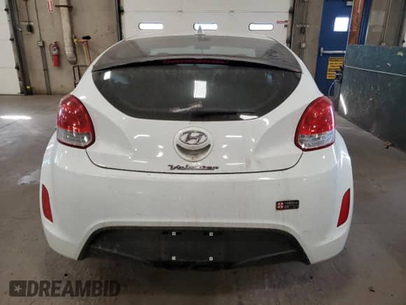 2013 Hyundai Veloster w/Gray Int z VIN KMHTC6AD1DU094831, wystawiony jako Copart lot #85944185 z przebiegiem 156 796 mil mil oraz Szkoda całkowita • Salvage title. Historia ofert i sprzedaży dostępna na DreamBid. Obrazek 6.