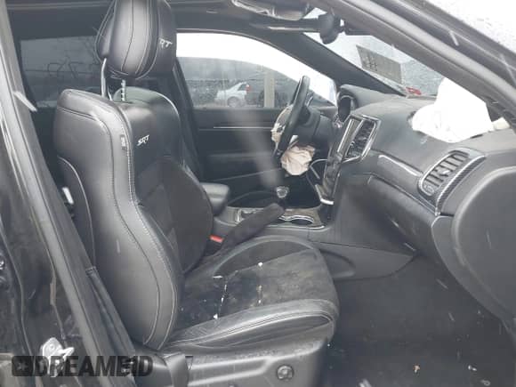 2015 Jeep Grand Cherokee SRT z VIN 1C4RJFDJ4FC613076, wystawiony jako IAAI lot #41732272 z przebiegiem 152 538 mil mil oraz . Historia ofert i sprzedaży dostępna na DreamBid. Obrazek 5.