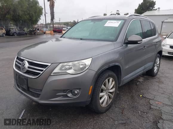 2011 Volkswagen Tiguan SE with VIN WVGAV7AX4BW515069, listed as a IAAI auction lot 41813579 with 100,644 mi miles and . Bid and sale history available at DreamBid. Image 2.