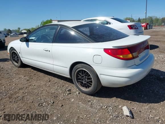 1997 Saturn 2dr Coupe with VIN 1G8ZH1270VZ235219, listed as a IAAI auction lot 42229262 with 107,874 mi miles and . Bid and sale history available at DreamBid. Image 3.