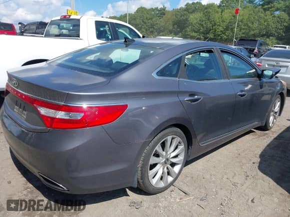 2012 Hyundai Azera with VIN KMHFH4JG0CA191967, listed as a IAAI auction lot 43205528 with 56,890 mi miles and . Bid and sale history available at DreamBid. Image 4.