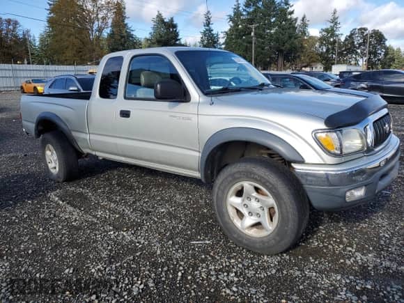 2001 Toyota Tacoma с VIN 5TEWN72N11Z840707, выставлен на аукционе Copart как лот 82088715 с пробегом 405 448 миль миль и Списание • Salvage title. История ставок и продаж доступна на DreamBid. Изображение 4.