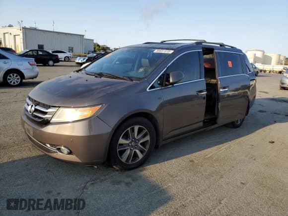 2015 Honda Odyssey Touring Elite с VIN 5FNRL5H94FB078340, выставлен на аукционе Copart как лот 80651515 с пробегом 171 249 миль миль и Списание • Salvage title. История ставок и продаж доступна на DreamBid. Изображение 1.