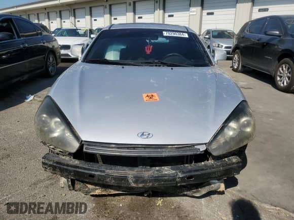 2007 Hyundai Tiburon GT с VIN KMHHN66F47U236460, выставлен на аукционе Copart как лот 70290384 с пробегом Не указан миль и Списание • Salvage title. История ставок и продаж доступна на DreamBid. Изображение 5.