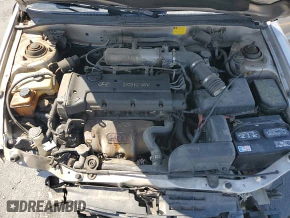 1999 Hyundai Elantra GL z VIN KMHJF25F4XU842009, wystawiony jako Copart lot #60836875 z przebiegiem 190 248 mil mil oraz Szkoda całkowita • Salvage title. Historia ofert i sprzedaży dostępna na DreamBid. Obrazek 11.