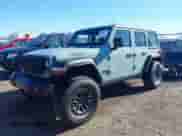 2024 Jeep Wrangler Willys with VIN 1C4RJXDNXRW135984, listed as a IAAI auction lot 40789537 with 6,609 mi miles and . Bid and sale history available at DreamBid. Image 2.