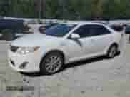 2012 Toyota Camry XLE z VIN 4T1BD1FK8CU022512, wystawiony jako Copart lot #82413865 z przebiegiem Nie podano mil oraz Szkoda całkowita • Salvage title. Historia ofert i sprzedaży dostępna na DreamBid. Obrazek 1.