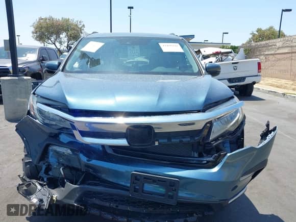 2021 Honda Pilot Touring 7-Passenger z VIN 5FNYF5H63MB039129, wystawiony jako IAAI lot #42455224 z przebiegiem Nie podano mil oraz . Historia ofert i sprzedaży dostępna na DreamBid. Obrazek 11.