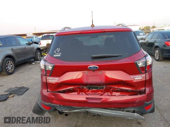 2017 Ford Escape Titanium with VIN 1FMCU0J97HUB23535, listed as a IAAI auction lot 43246540 with 97,026 mi miles and . Bid and sale history available at DreamBid. Image 16.