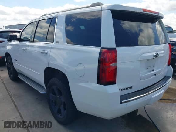 2015 Chevrolet Tahoe LTZ with VIN 1GNSCCKC8FR196600, listed as a IAAI auction lot 42806686 with 119,637 mi miles and . Bid and sale history available at DreamBid. Image 3.