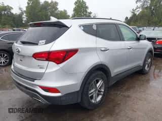 2018 Hyundai Santa Fe 2.4L z VIN 5XYZUDLB1JG554353, wystawiony jako IAAI lot #43426577 z przebiegiem 154 094 mil mil oraz . Historia ofert i sprzedaży dostępna na DreamBid. Obrazek 4.