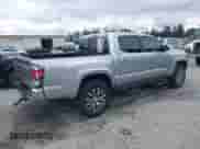2022 Toyota Tacoma Limited with VIN 3TMGZ5AN2NM504615, listed as a IAAI auction lot 42261699 with 58,141 mi miles and . Bid and sale history available at DreamBid. Image 4.