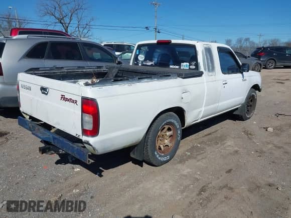 1999 Nissan Frontier XE with VIN 1N6DD26S0XC325585, listed as a IAAI auction lot 41698620 with 209,973 mi miles and . Bid and sale history available at DreamBid. Image 4.