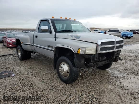 1997 Dodge RAM with VIN 1B7MF36D0VJ607125, listed as a Copart auction lot 87432394 with 243,794 mi miles and Salvage title. Bid and sale history available at DreamBid. Image 4.