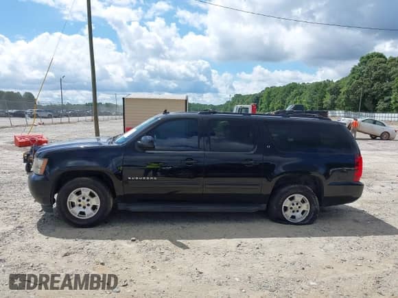 2010 Chevrolet Suburban LT z VIN 1GNUCJE08AR192831, wystawiony jako IAAI lot #42534754 z przebiegiem 165 741 mil mil oraz . Historia ofert i sprzedaży dostępna na DreamBid. Obrazek 14.