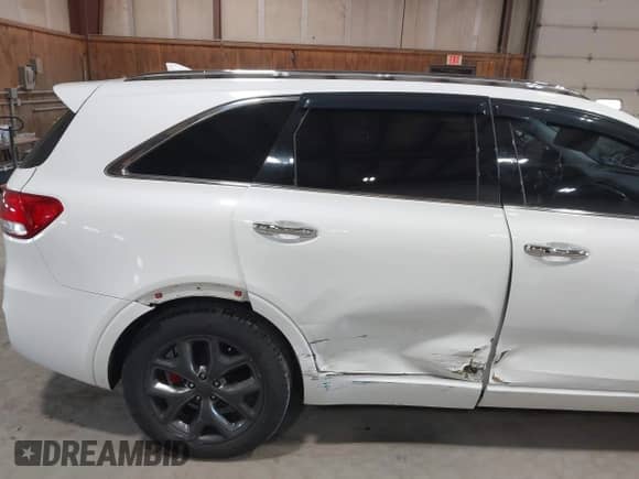 2016 Kia Sorento SXL z VIN 5XYPKDA56GG163444, wystawiony jako IAAI lot #42396163 z przebiegiem 61 347 mil mil oraz . Historia ofert i sprzedaży dostępna na DreamBid. Obrazek 6.