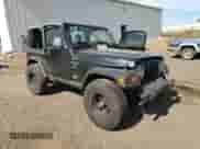 1998 Jeep Wrangler Sport z VIN 1J4FY19SXWP734488, wystawiony jako Copart lot #81896775 z przebiegiem 180 236 mil mil oraz Czysty tytuł • Clean title. Historia ofert i sprzedaży dostępna na DreamBid. Obrazek 4.