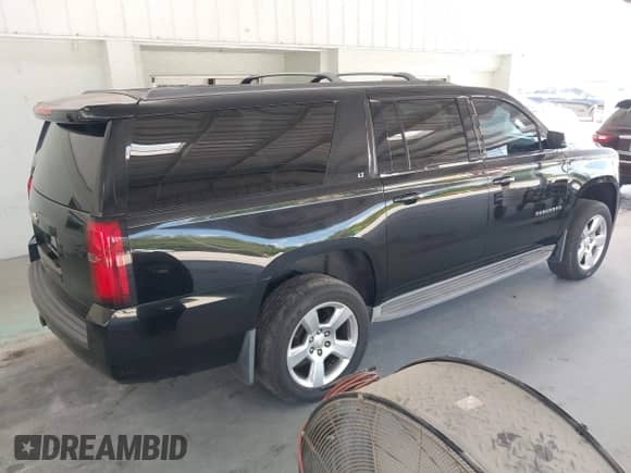 2015 Chevrolet Suburban LT z VIN 1GNSKJKC7FR199544, wystawiony jako IAAI lot #42169017 z przebiegiem 219 219 mil mil oraz . Historia ofert i sprzedaży dostępna na DreamBid. Obrazek 4.