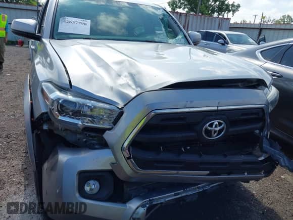 2017 Toyota Tacoma SR5 with VIN 5TFAZ5CN7HX047818, listed as a IAAI auction lot 42637798 with 131,616 mi miles and . Bid and sale history available at DreamBid. Image 6.