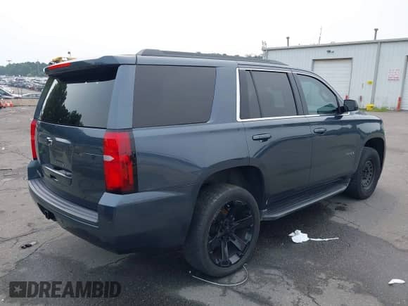 2019 Chevrolet Tahoe LS with VIN 1GNSCAKC5KR188730, listed as a IAAI auction lot 42760811 with 183,487 mi miles and . Bid and sale history available at DreamBid. Image 4.