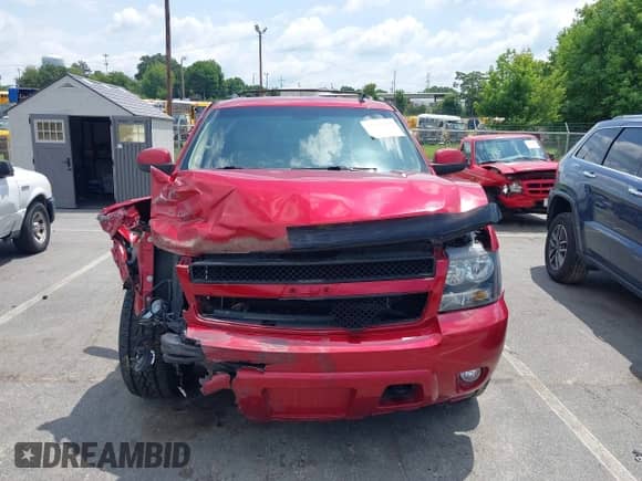 2013 Chevrolet Tahoe LT z VIN 1GNSKBE07DR140787, wystawiony jako IAAI lot #42792275 z przebiegiem 128 778 mil mil oraz . Historia ofert i sprzedaży dostępna na DreamBid. Obrazek 12.